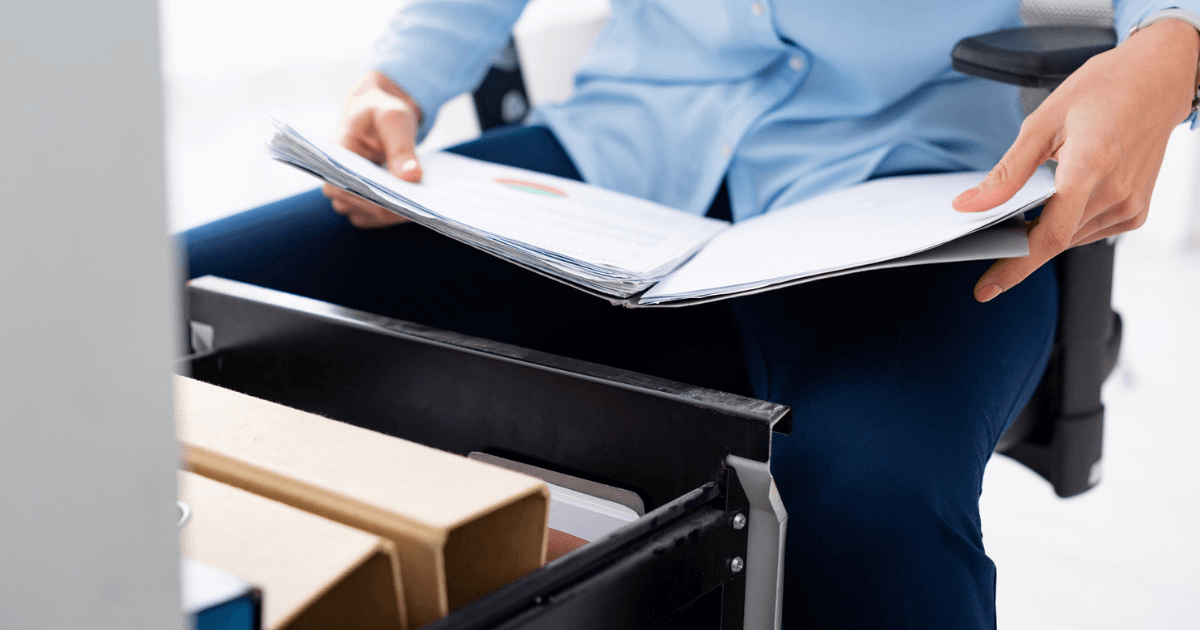 A senior living consultant with a binder in hands.